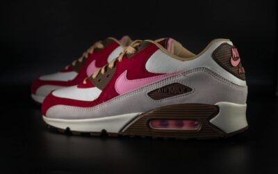 Close-up of stylish Nike Air Max sneakers in vibrant colors on a dark backdrop.