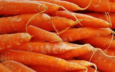 Vibrant close-up of fresh orange carrots, perfect for healthy organic cooking inspiration.