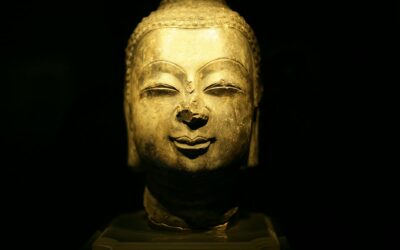 Close-up of an ancient Buddha sculpture conveying calm and harmony.