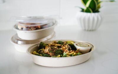 A nutritious takeout meal featuring broccoli and seeds, neatly packaged for convenience.
