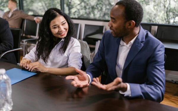 A diverse group of professionals having a collaborative business meeting indoors.
